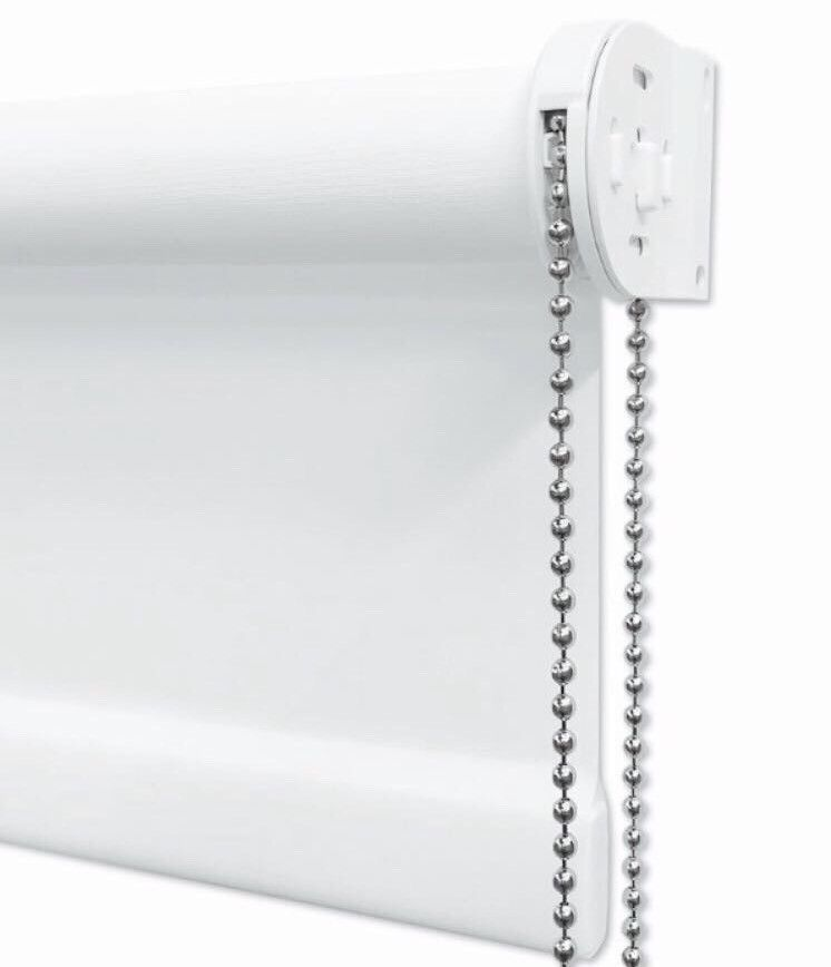 Photo of the end of a white roller blind showing the control mechanism with a chrome bead chain hanging from it.