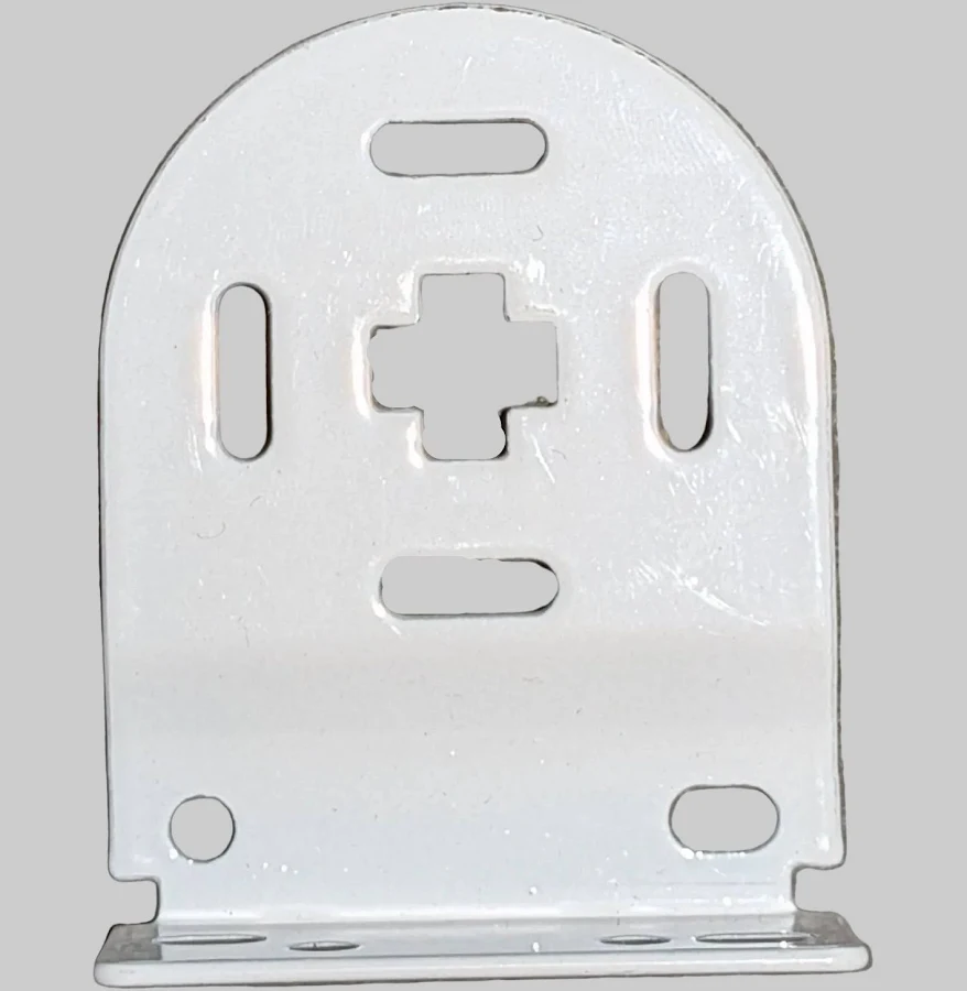 Photo of the control-end bracket: a rounded white metal bracket with a cross-shaped centre surrounded by slots, plus fixing holes near the base.